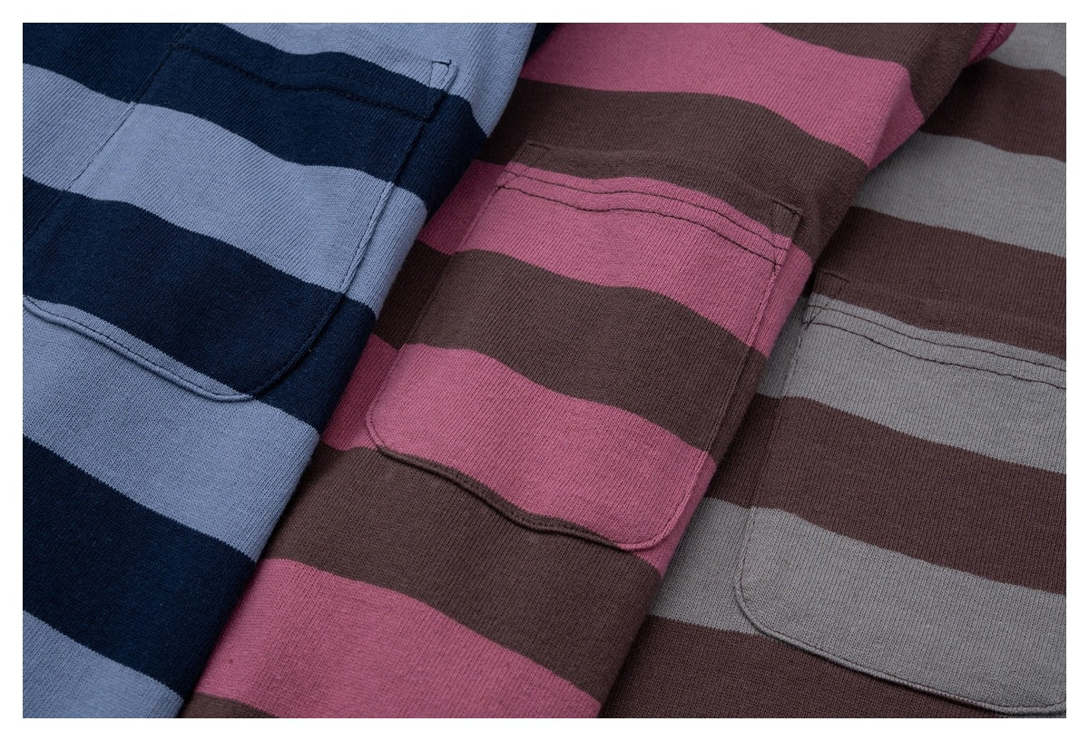 Close-up of three striped knit garment colorways with chest pockets: navy and light blue, brown and pink, and brown and gray.