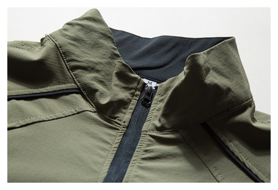 Close-up of an olive pullover's raised collar and black quarter zipper with dark inner lining.