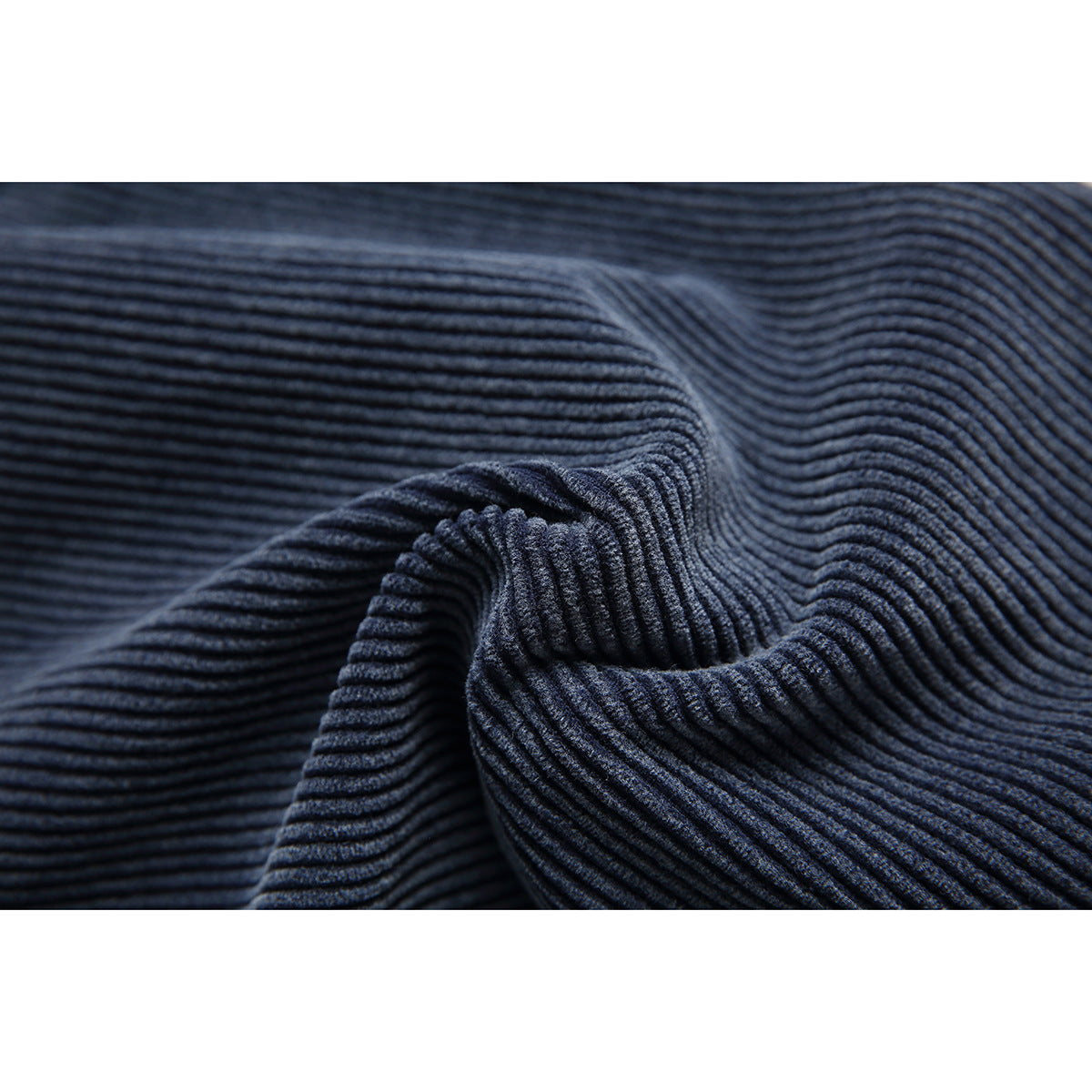 Macro view of the raised ribbed texture on navy fabric.