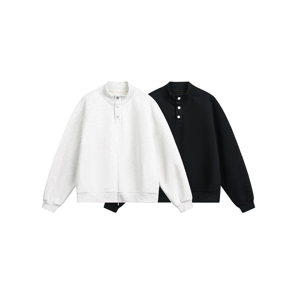 Light gray and black stand-collar sweatshirts shown from the front, each with a short snap-button placket.