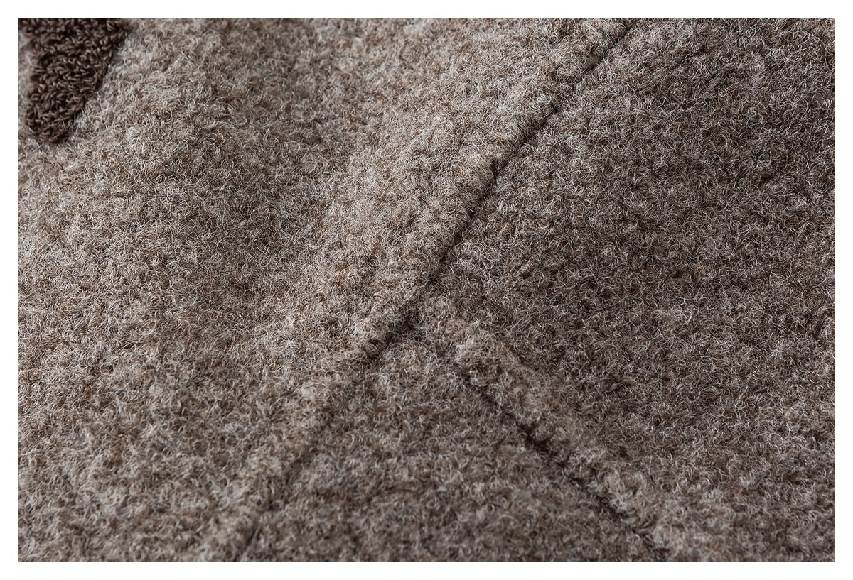 Extreme close-up showing the textured beige and brown knit fabric.