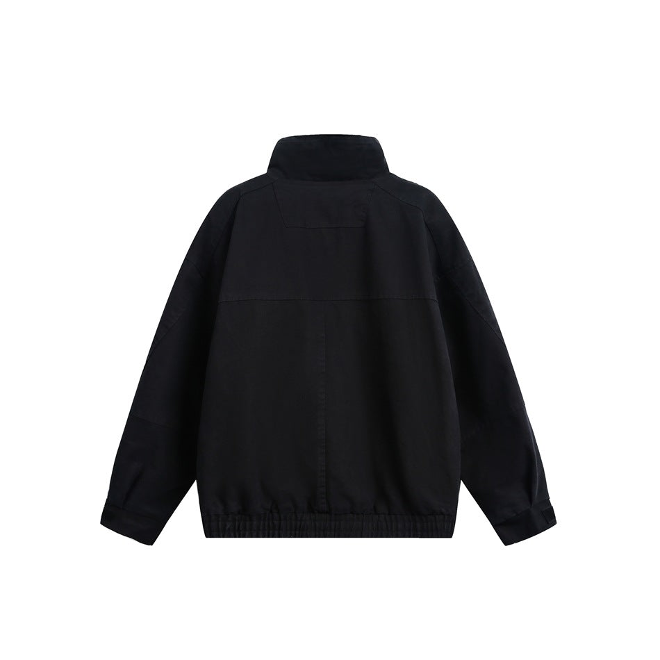 Black stand-collar jacket, flat back view with paneled seams and an elastic hem