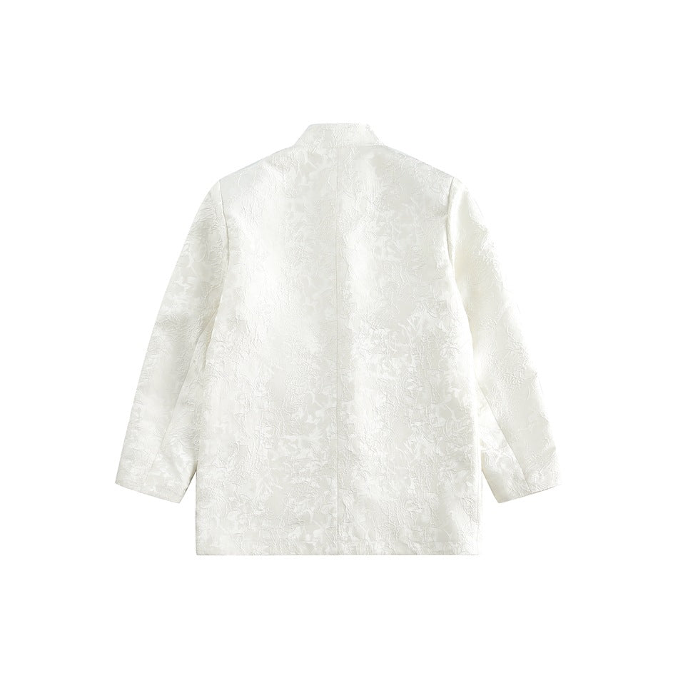 Back view of an ivory long-sleeve jacket with a stand collar and subtle floral pattern.