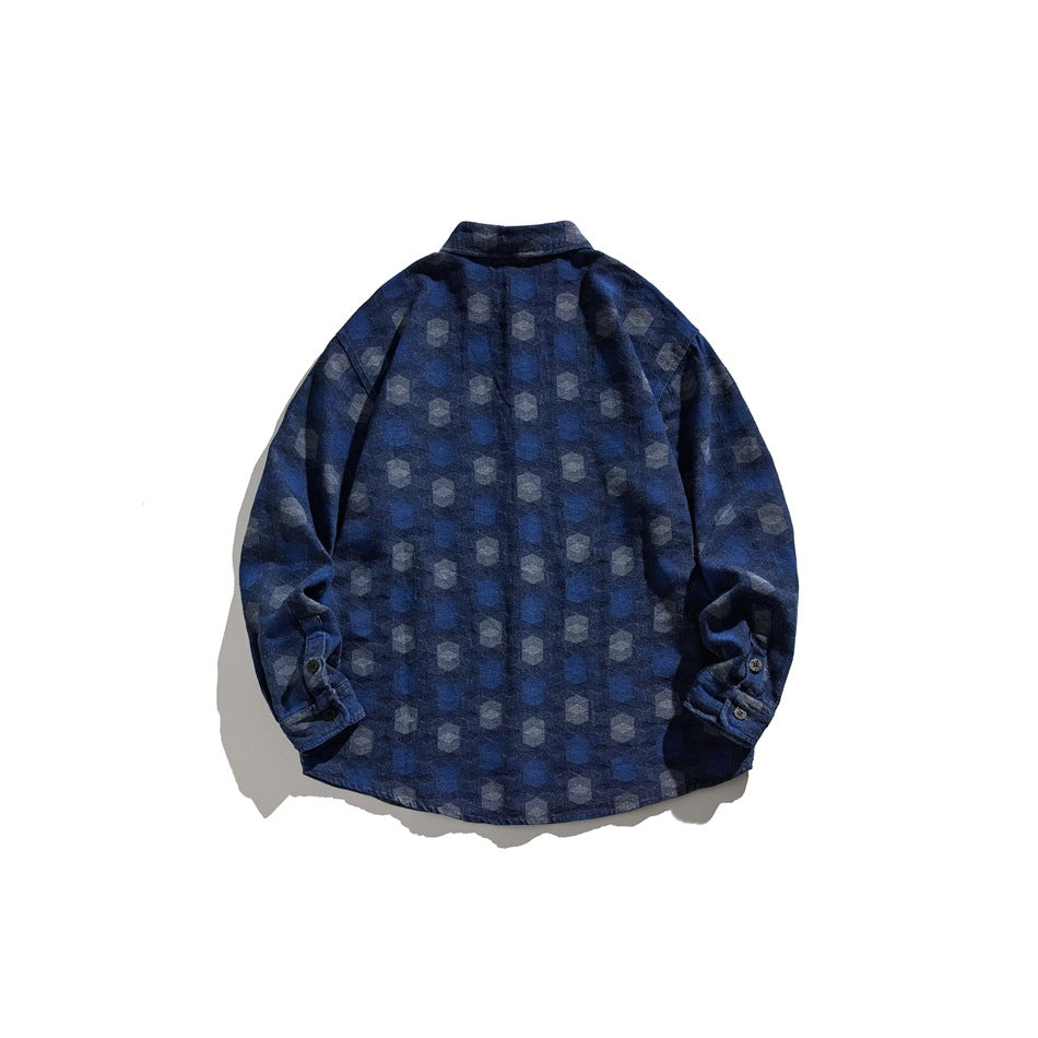 Back view of washed blue long-sleeve shirt with hexagon pattern and buttoned cuffs, flat lay