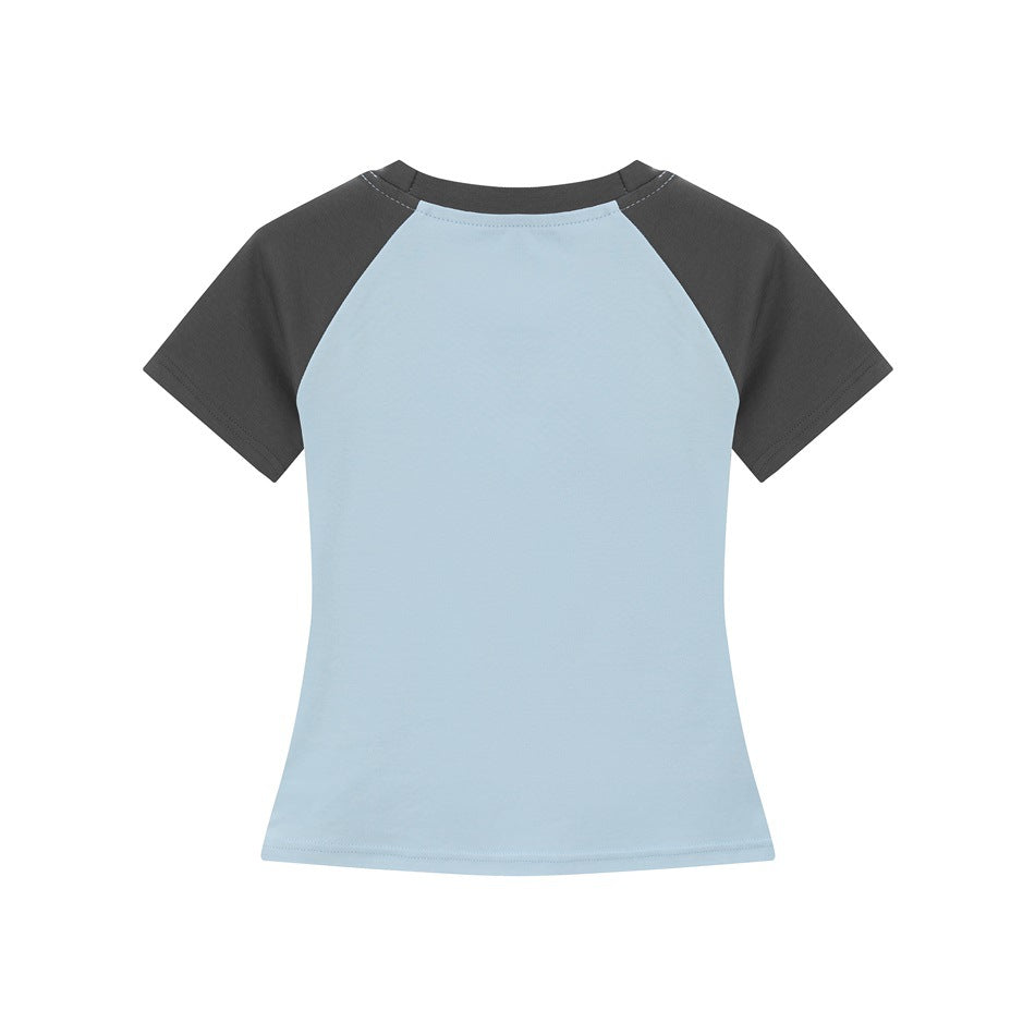 Back view of light blue raglan T-shirt with dark gray sleeves and collar, plain back, flat lay