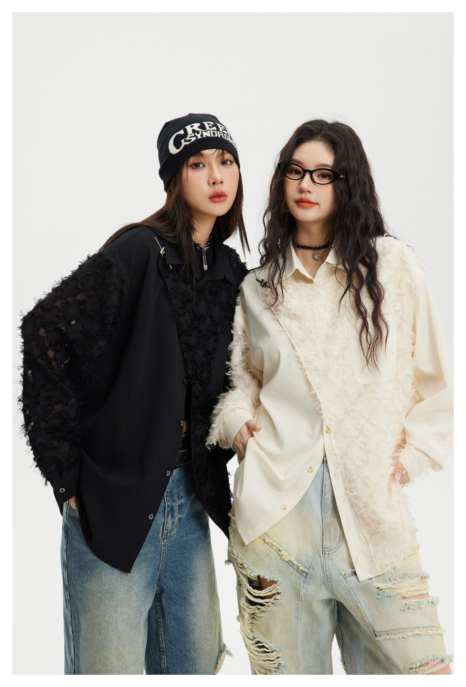 Two models wearing oversized button-up shirts: one black with textured panels and one ivory with shaggy panels.