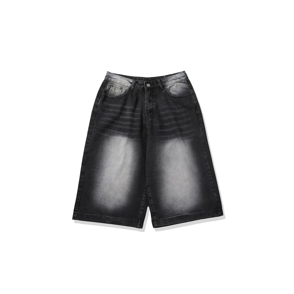 Black faded-wash denim knee-length shorts with wide leg, shown flat from the front on a white background