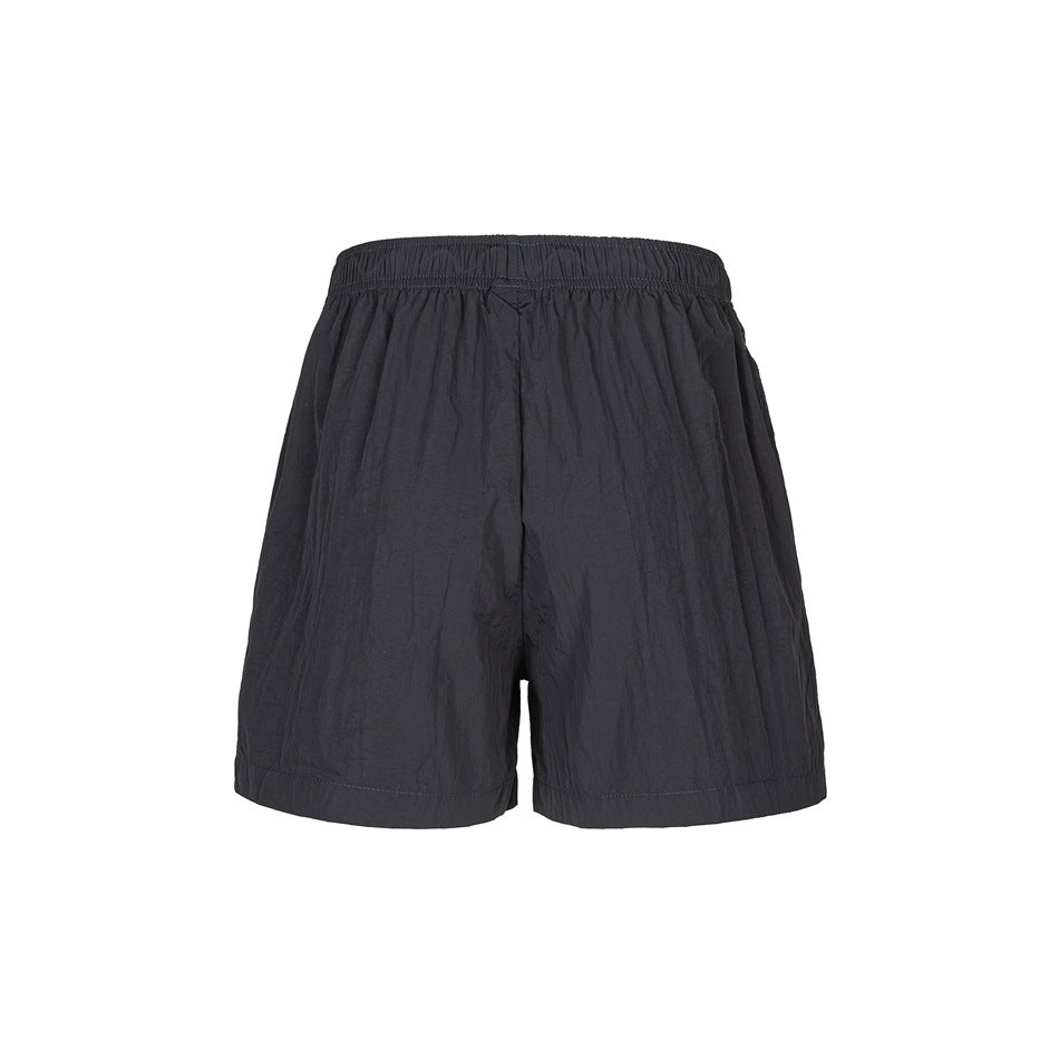 Back view of charcoal shorts with an elastic waistband and straight hems.