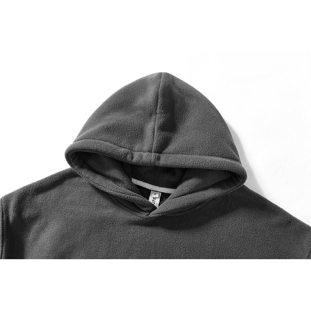 Close-up of a charcoal gray hoodie’s hood and neckline on a white background.