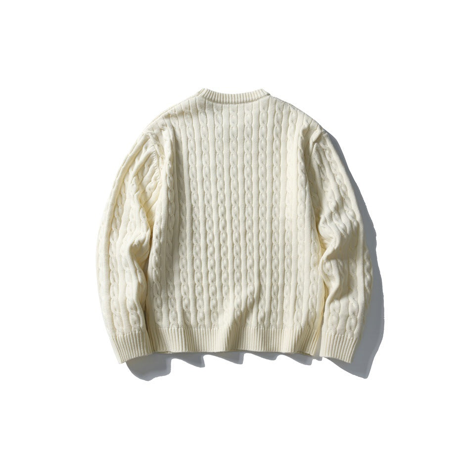 Back view of an ivory cable-knit crewneck sweater with long sleeves and ribbed trim.