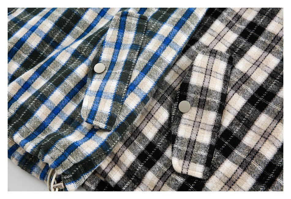Close-up of snap-button pocket flaps on blue-green and black-and-cream plaid jackets.