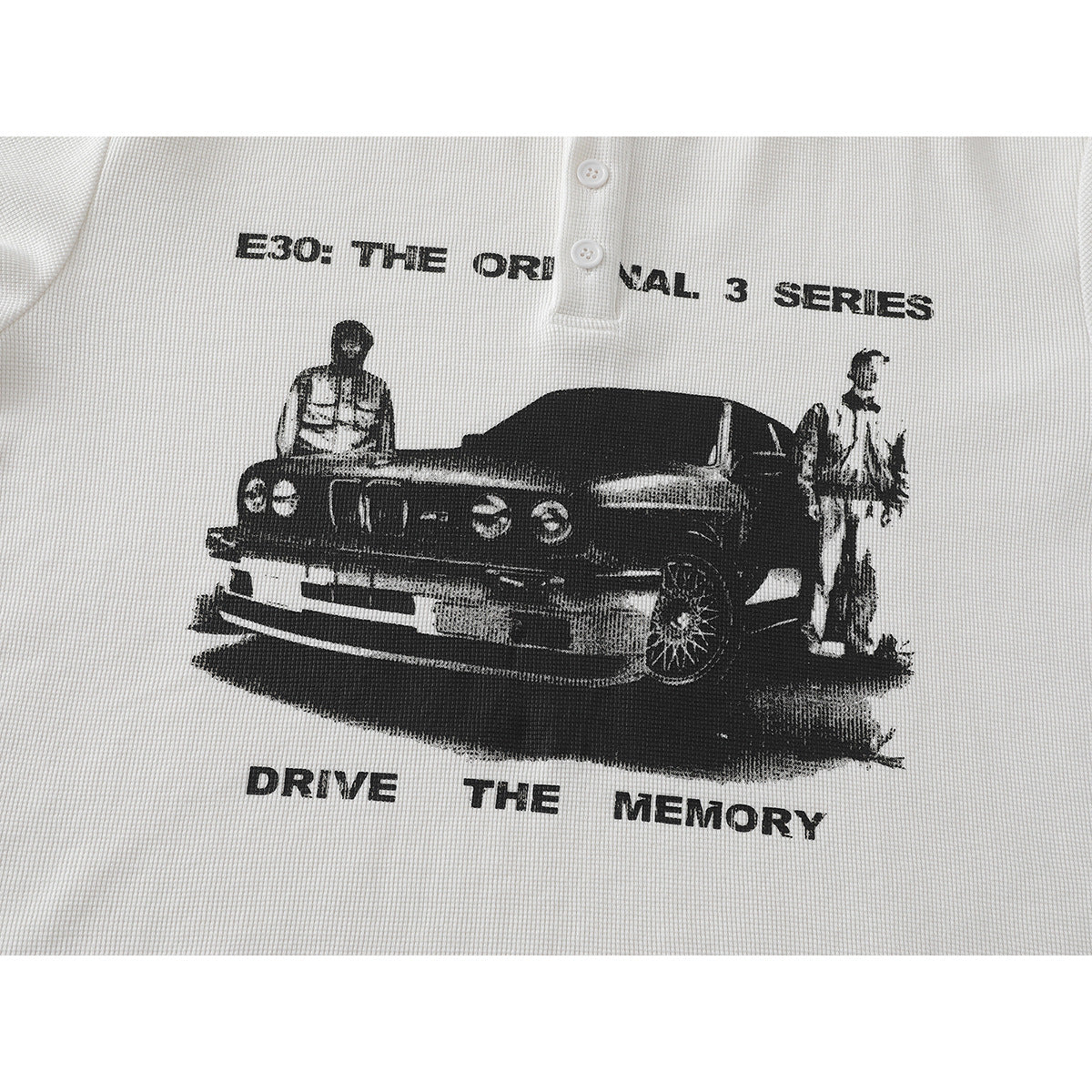 White textured henley shirt featuring a black vintage car graphic, two figures, and English slogan text.