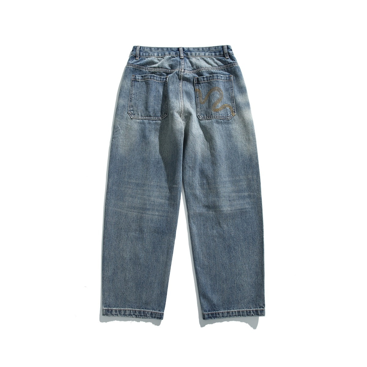 Full back view of faded blue jeans with two pockets, one featuring gold wavy stitching.