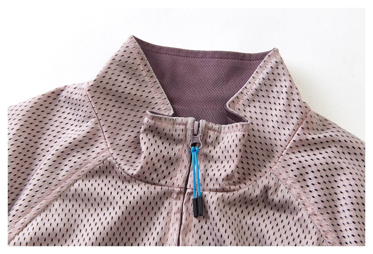 Close-up of the dusty mauve jacket's wide collar, perforated surface, and blue-cord front zipper.
