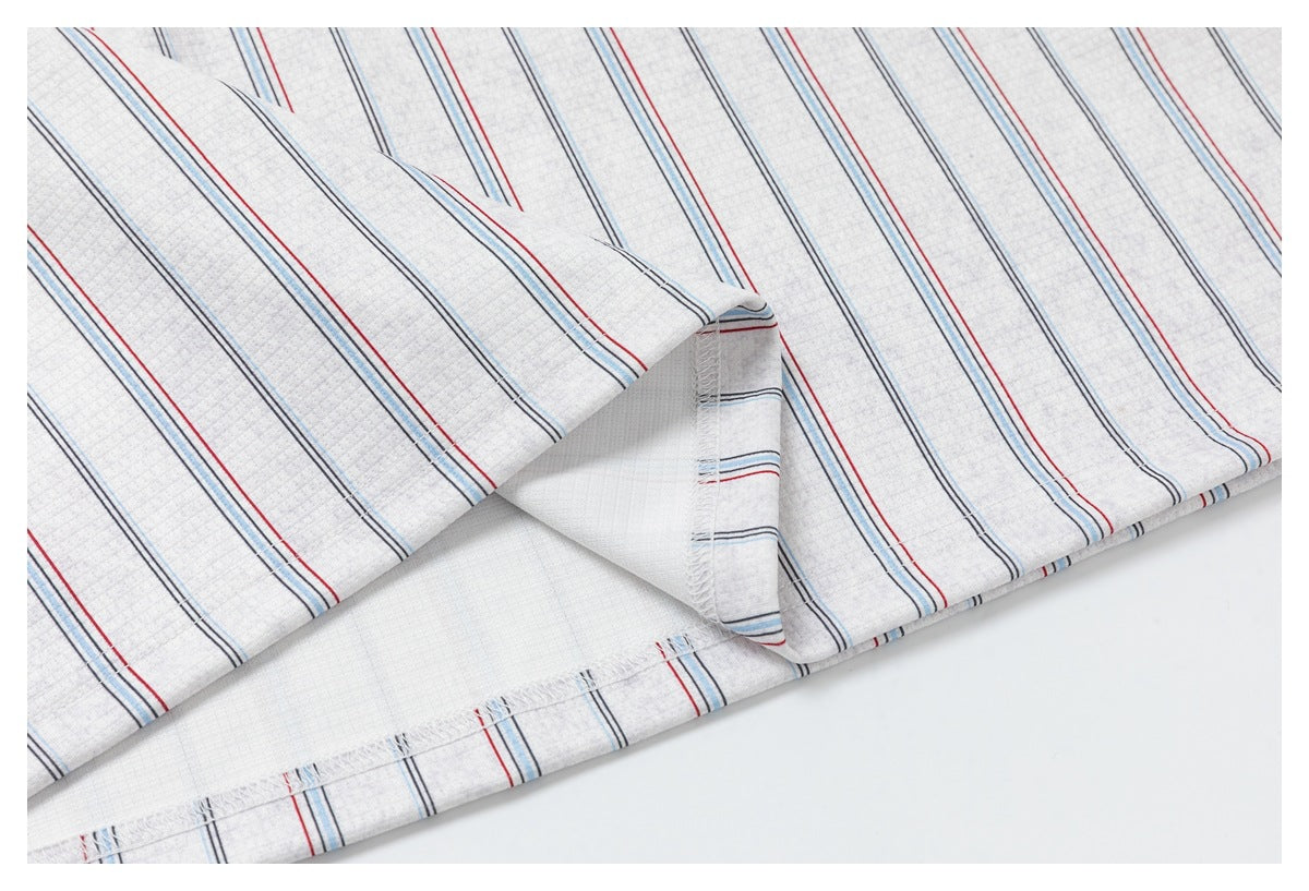 Close-up of striped fabric turned back to show its inner surface and overlocked seam.