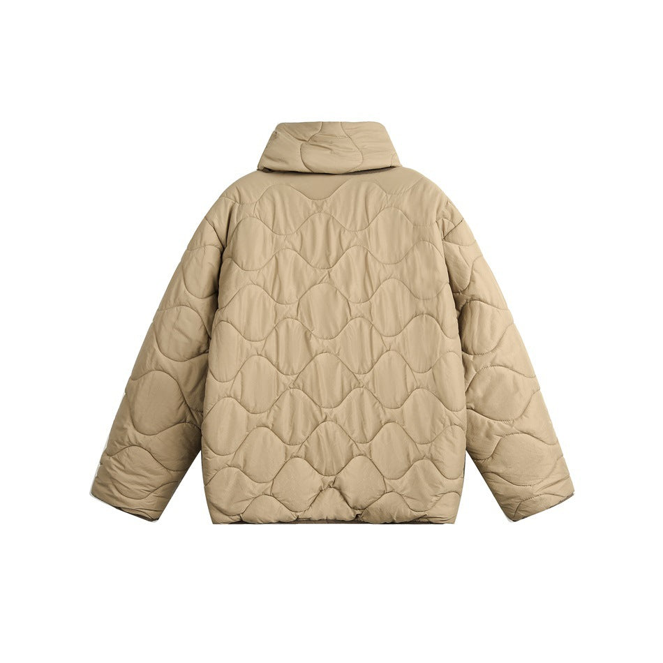 Back view of a beige quilted jacket with a raised collar and wavy stitched panels.