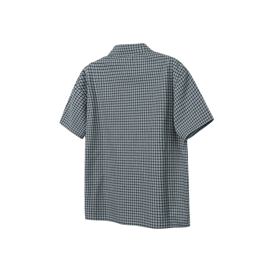 Back view of a black and white plaid short-sleeve shirt with a pointed collar