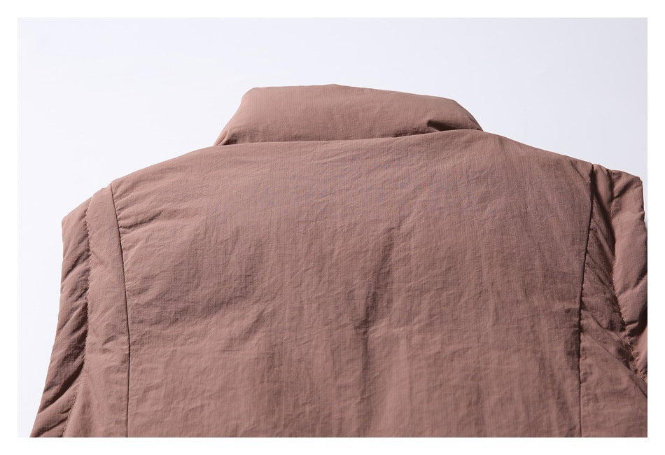 Close-up of the brown jacket's upper back and raised collar.