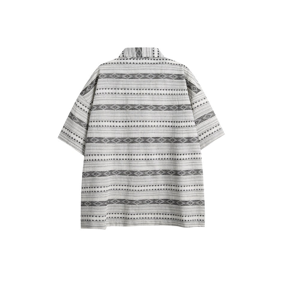 Back view of a short-sleeve collared shirt with horizontal black geometric stripes on a light background.