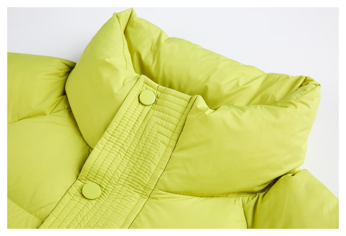 Close-up of a lime-green puffer jacket collar and stitched snap-button placket.