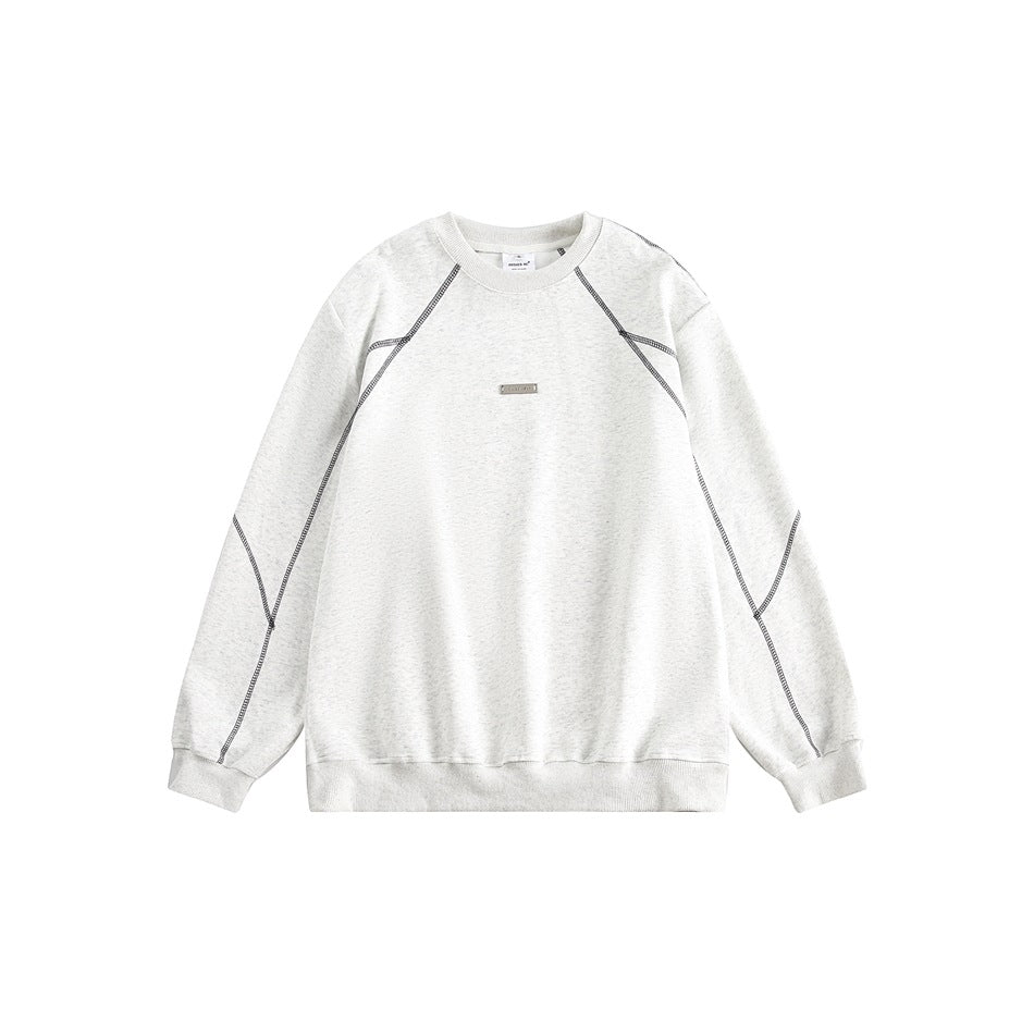 Light heather gray-white crew-neck sweatshirt with dark contrast topstitching and a small metal plate on the chest