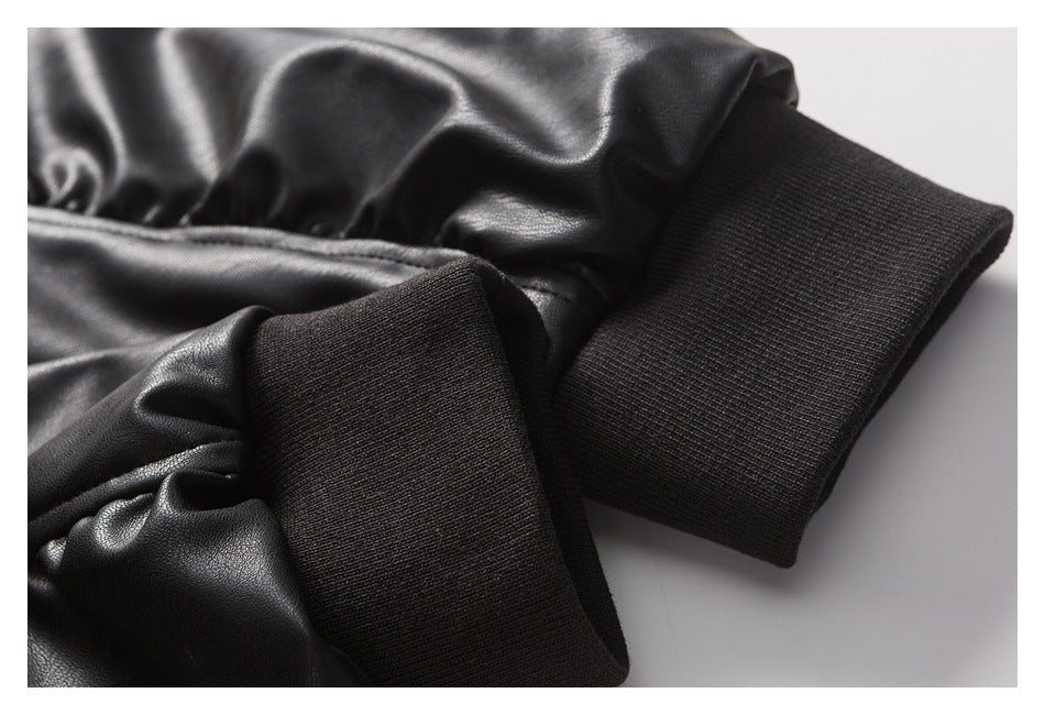 Close-up of a black jacket sleeve ending in a wide ribbed cuff.