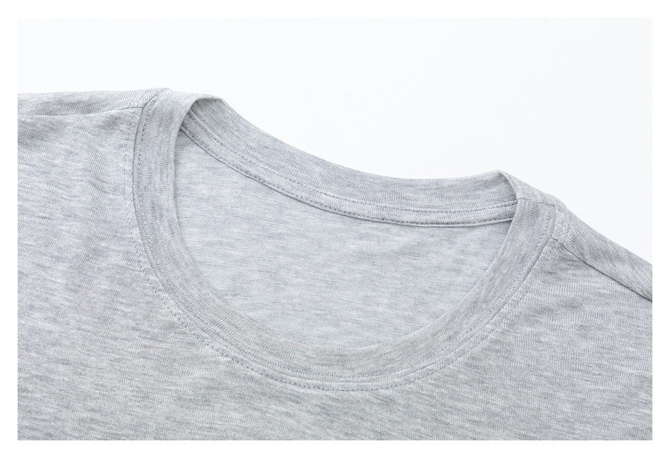 Close-up of a gray crew-neck T-shirt showing the collar and shoulder seams.