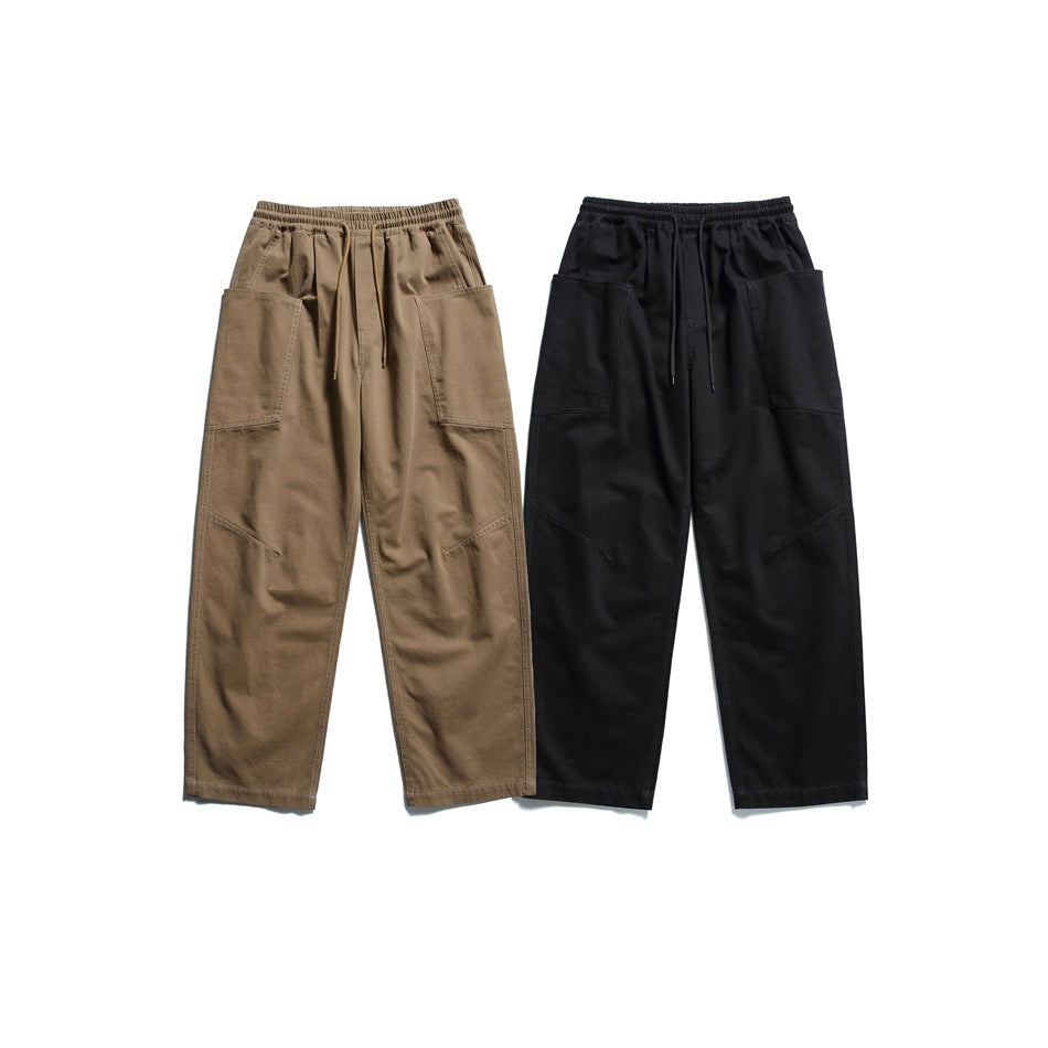Front view of relaxed cargo pants in brown and black, with elastic waists, drawcords, and large utility pockets.
