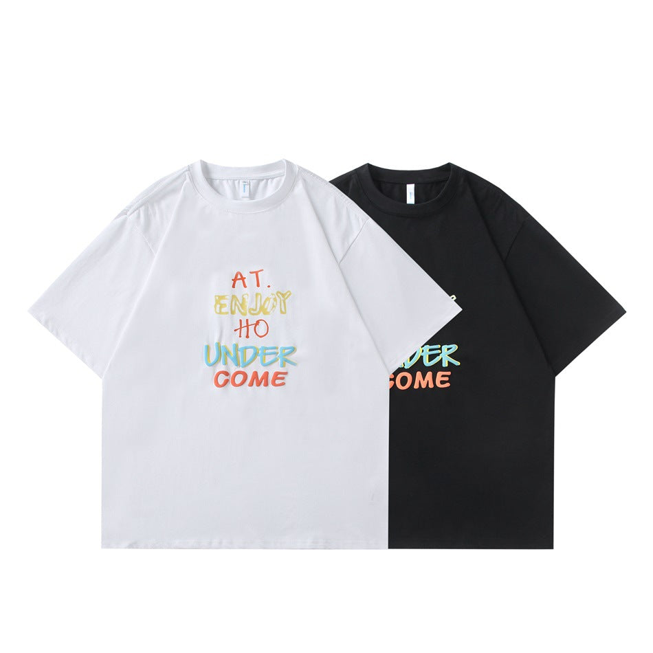 White and black short-sleeve crew-neck T-shirts shown from the front, each with colorful chest lettering.