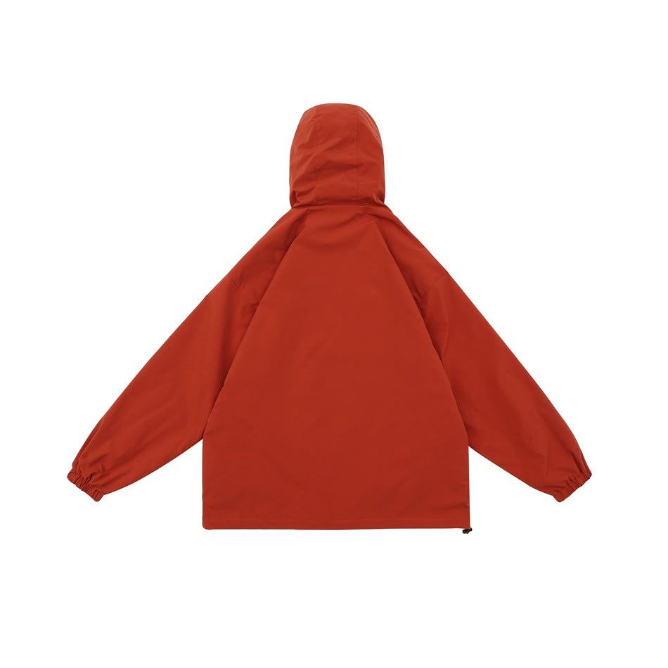 Rear view of a rust-red hooded jacket with long sleeves and elastic cuffs.