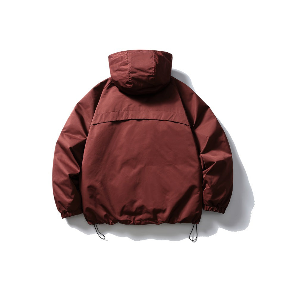 Back view of a burgundy hooded jacket with elastic cuffs and an adjustable drawcord hem, laid flat on white.