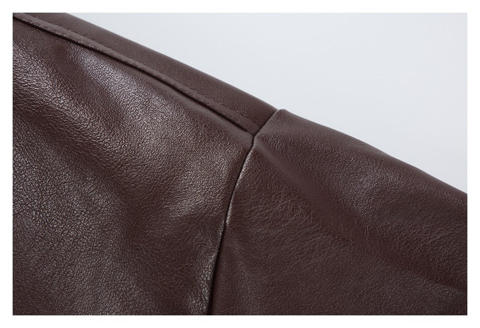 Close-up of a shoulder seam on the dark brown jacket.