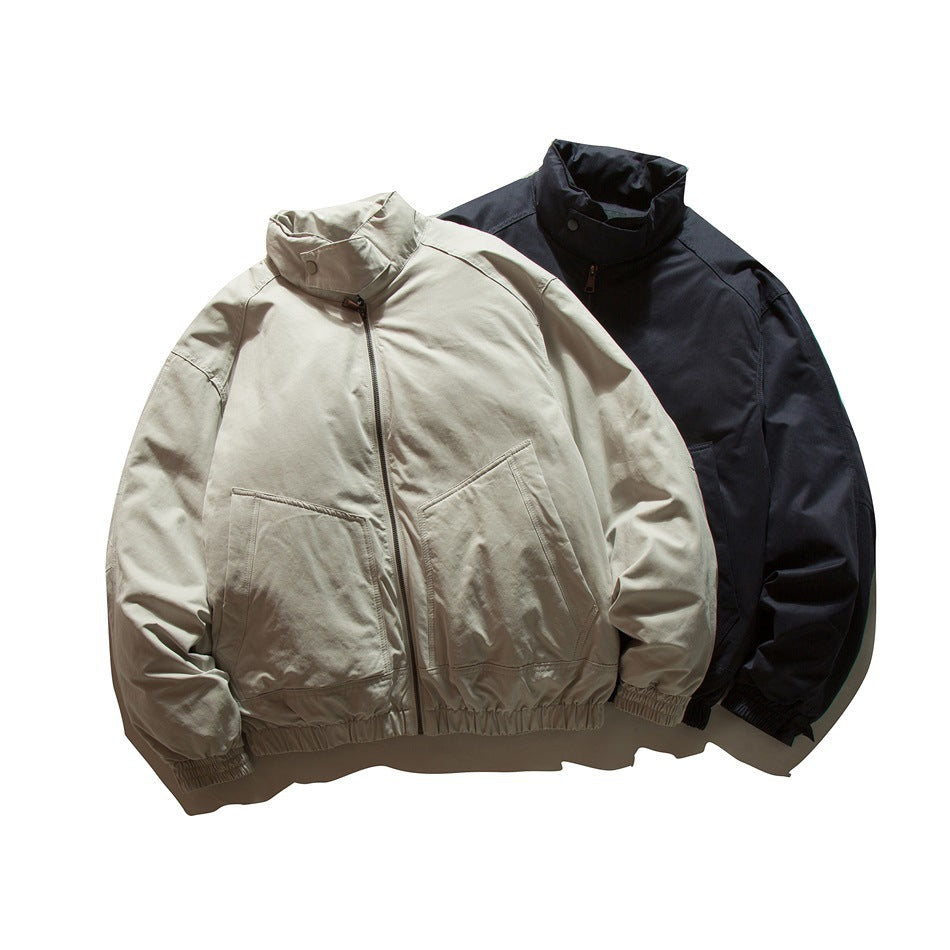 Front view of two zip-front jackets with high collars and large pockets, in beige and black.