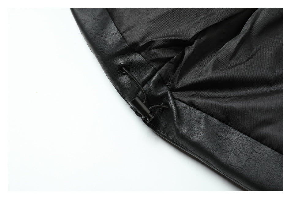 Close-up of the black jacket’s lining and hem drawcord with eyelets and a toggle.