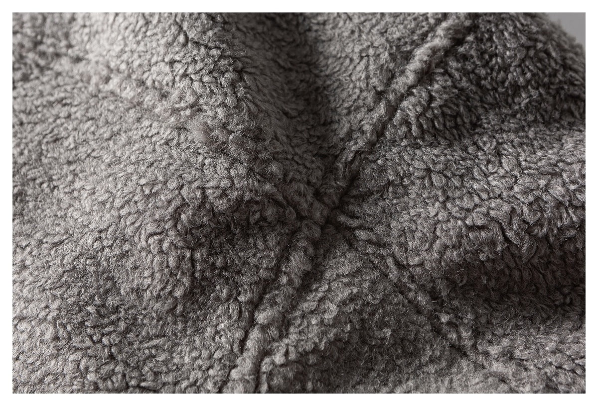 Macro view of gray fleece texture and a raised seam.