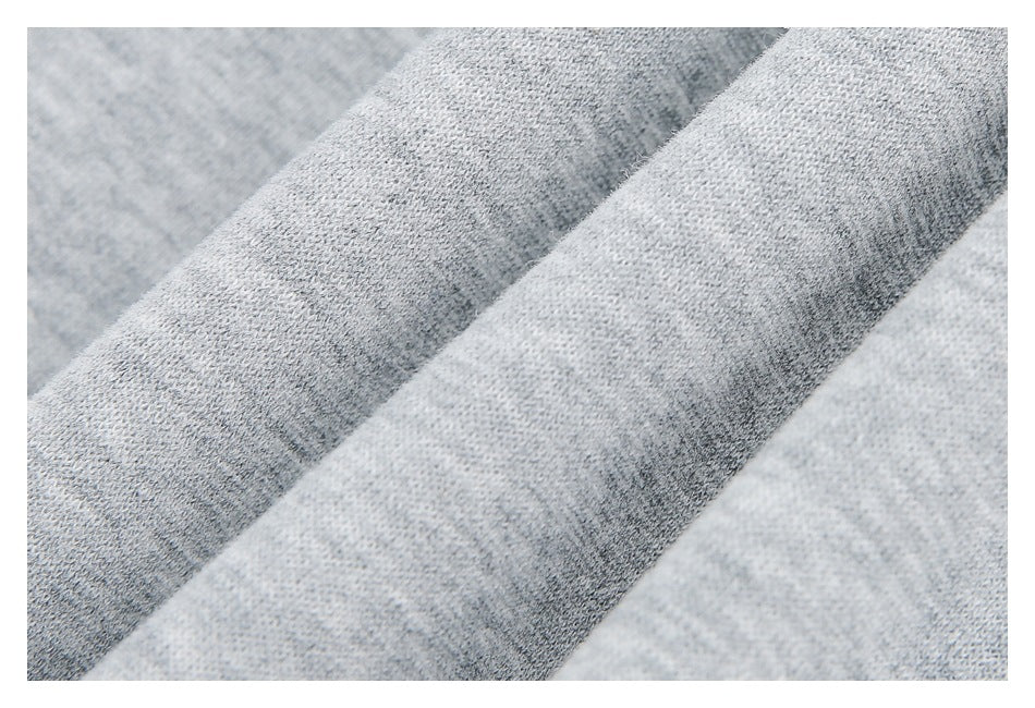 Extreme close-up of the light gray heathered knit fabric texture.