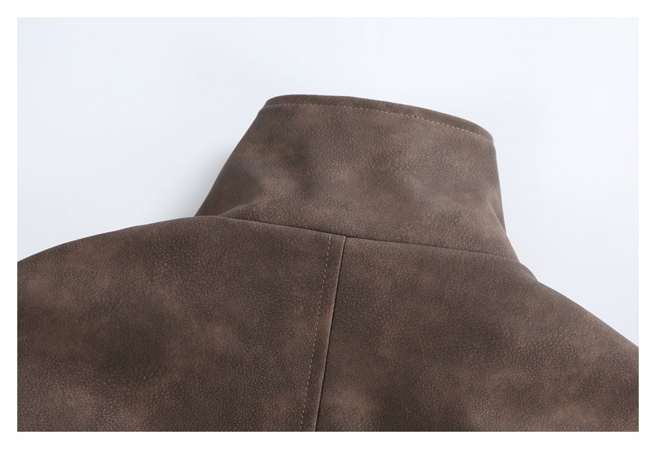 Close-up of the jacket's brown stand collar and upper back seam.