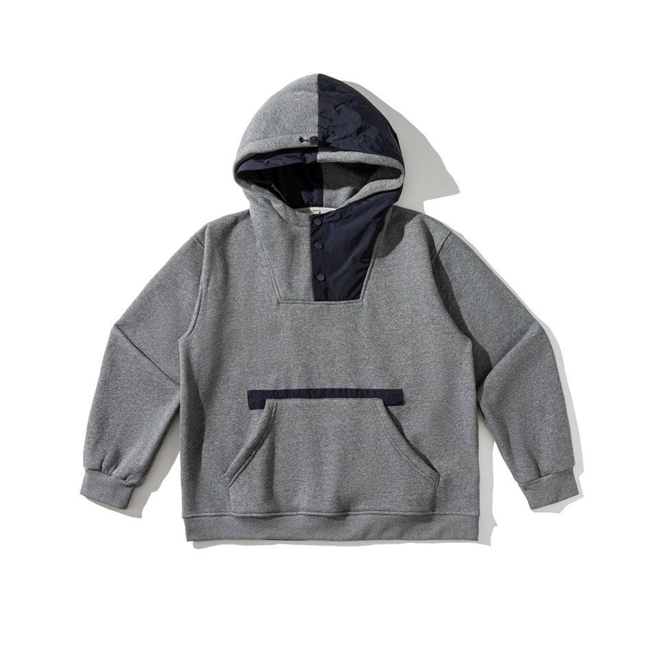 Gray heather hooded sweatshirt with navy color-block hood, snap placket and kangaroo pocket, flat lay