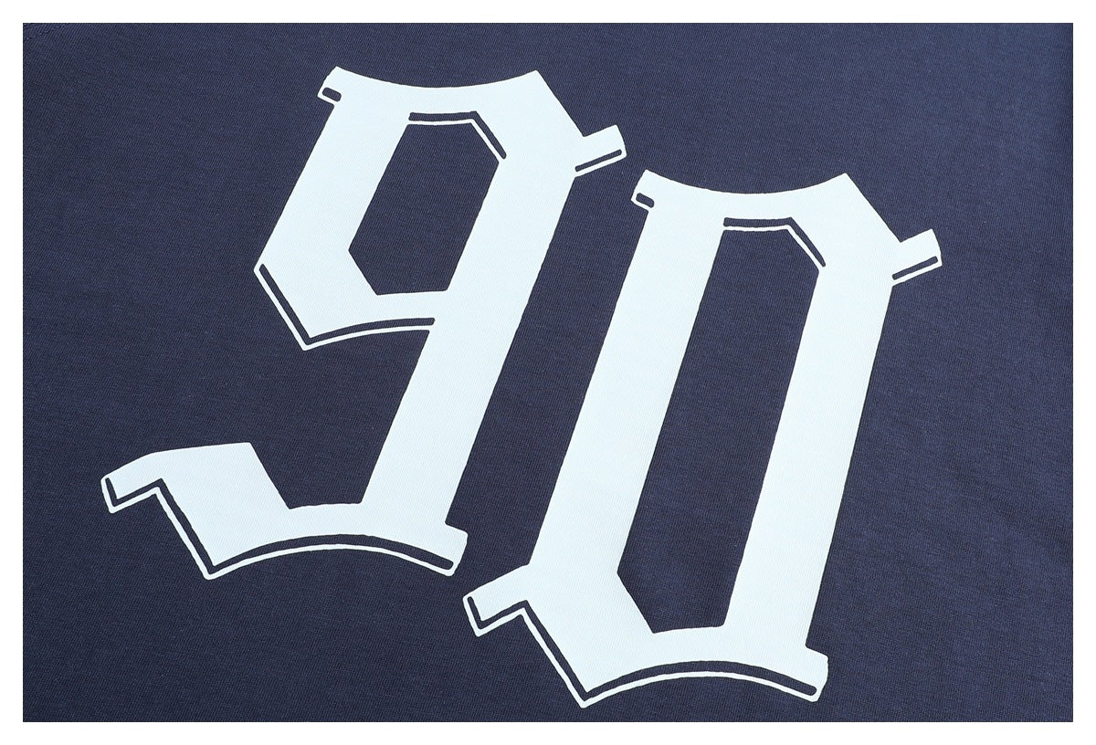 Close-up of a large white outlined graphic printed on dark navy T-shirt fabric.