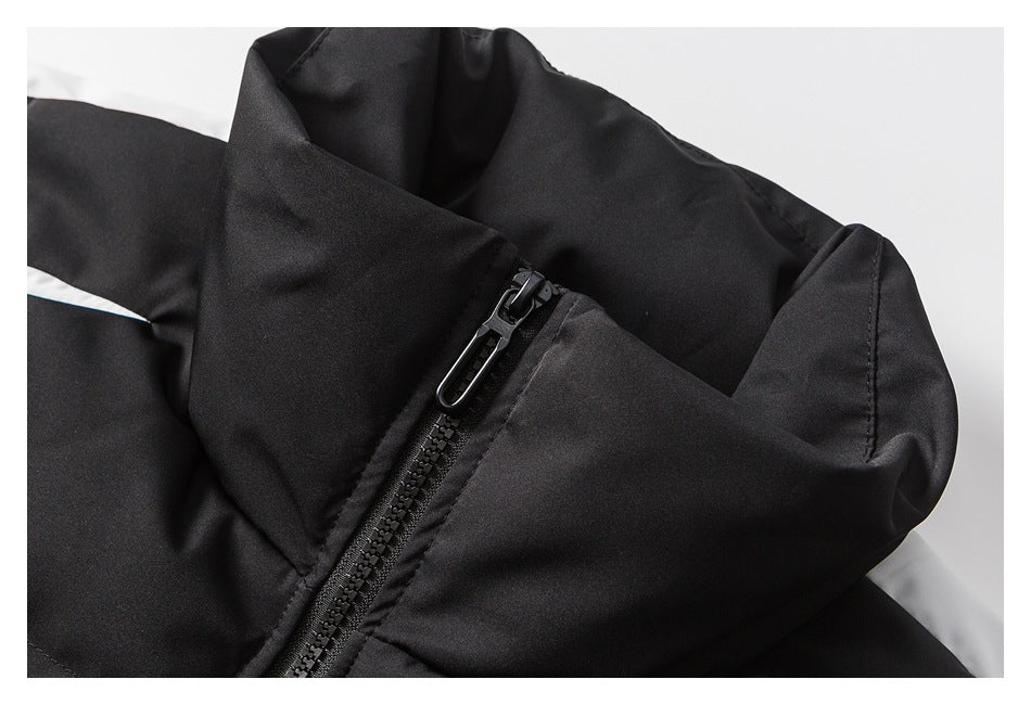 Close-up of the black jacket's zipper and high collar.