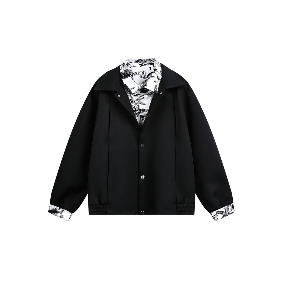 Black jacket flat lay with black-and-white print inner collar and cuffs, snap-button front and elastic hem