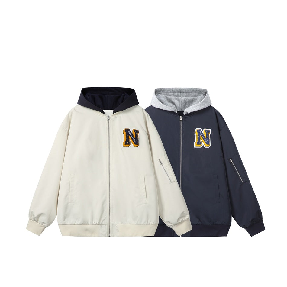 Front view of cream and navy hooded zip jackets with contrast hoods, pockets, sleeve zippers, and varsity-style N patches.