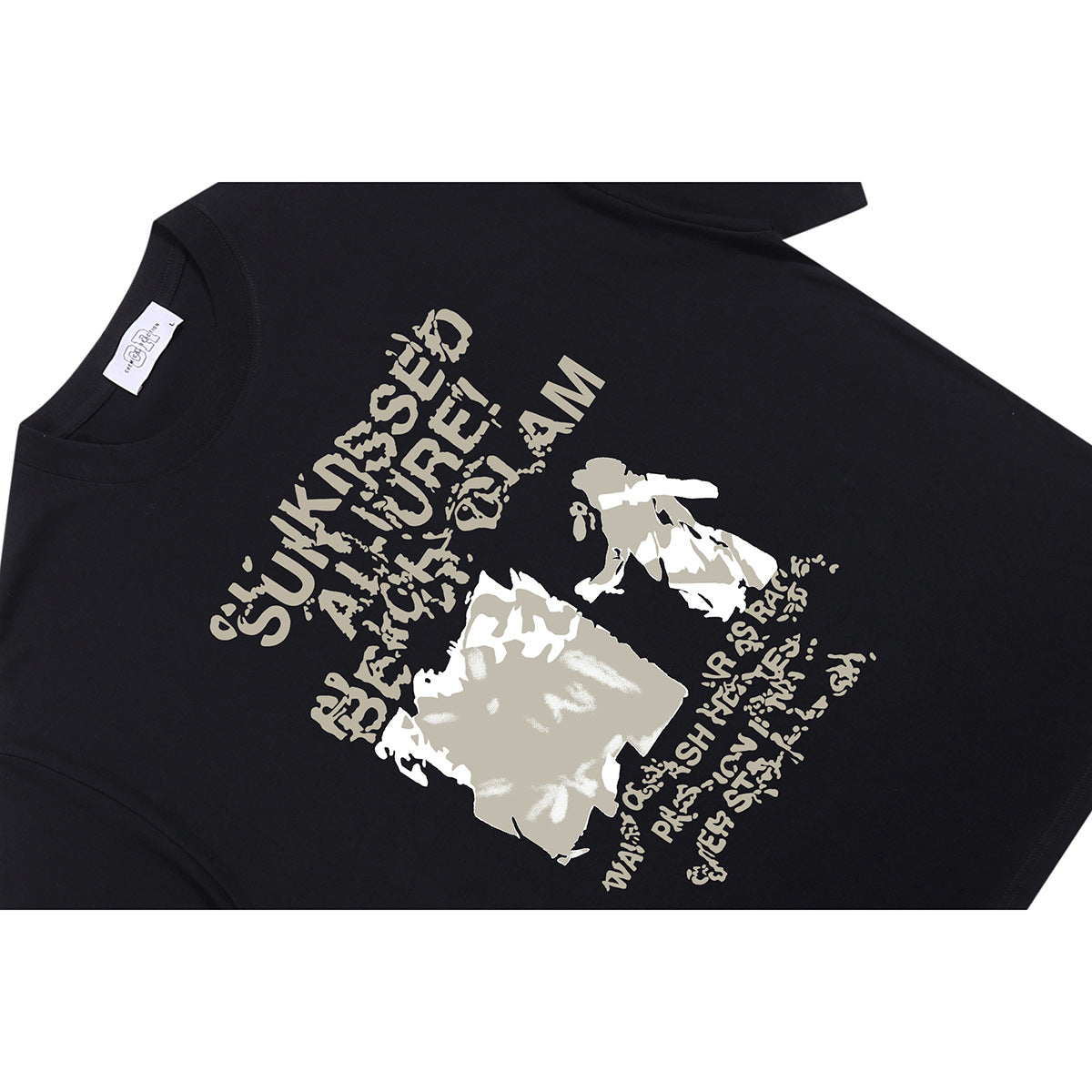 Angled flat lay of a black T-shirt with a large beige-and-white graphic and distressed lettering on the front.
