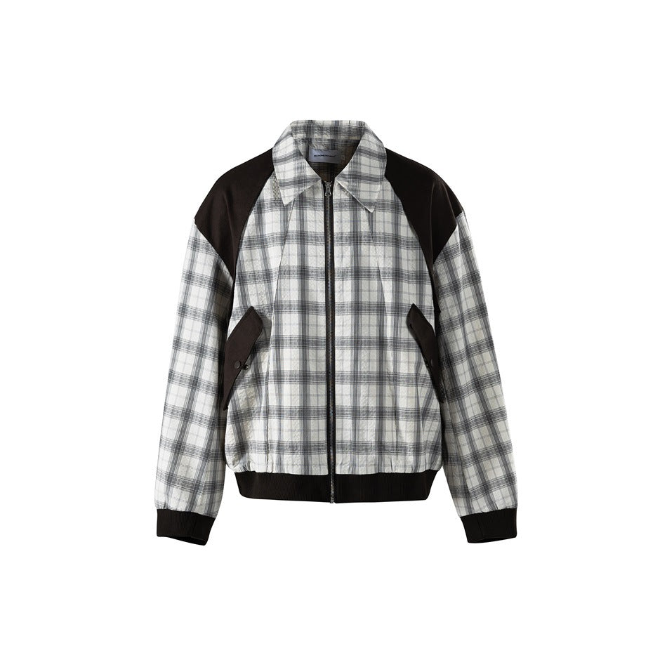 Black and white plaid zip jacket with black shoulder panels, flap pockets and ribbed hem, front view