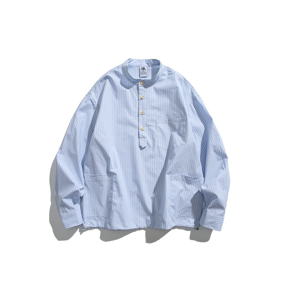 Light blue pinstriped band-collar pullover shirt, flat lay front with half-button placket and three patch pockets