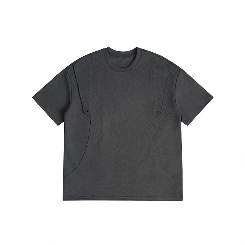 Dark gray short-sleeve crew-neck T-shirt with curved front seams and two small snap fasteners, flat lay