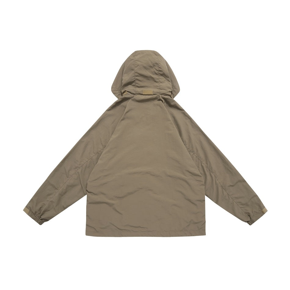 Back view of a taupe hooded jacket with long sleeves and gathered cuffs on a white background.