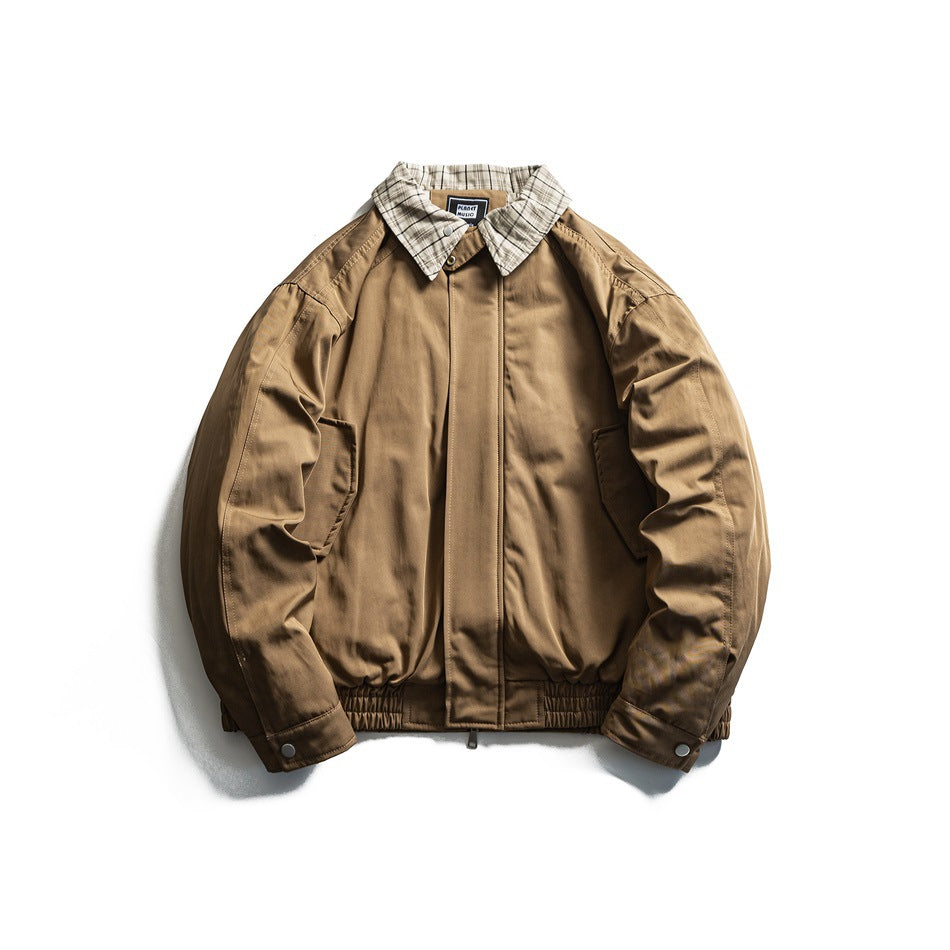 Khaki bomber-style jacket with plaid collar, front zip placket, side pockets and elastic hem, flat lay