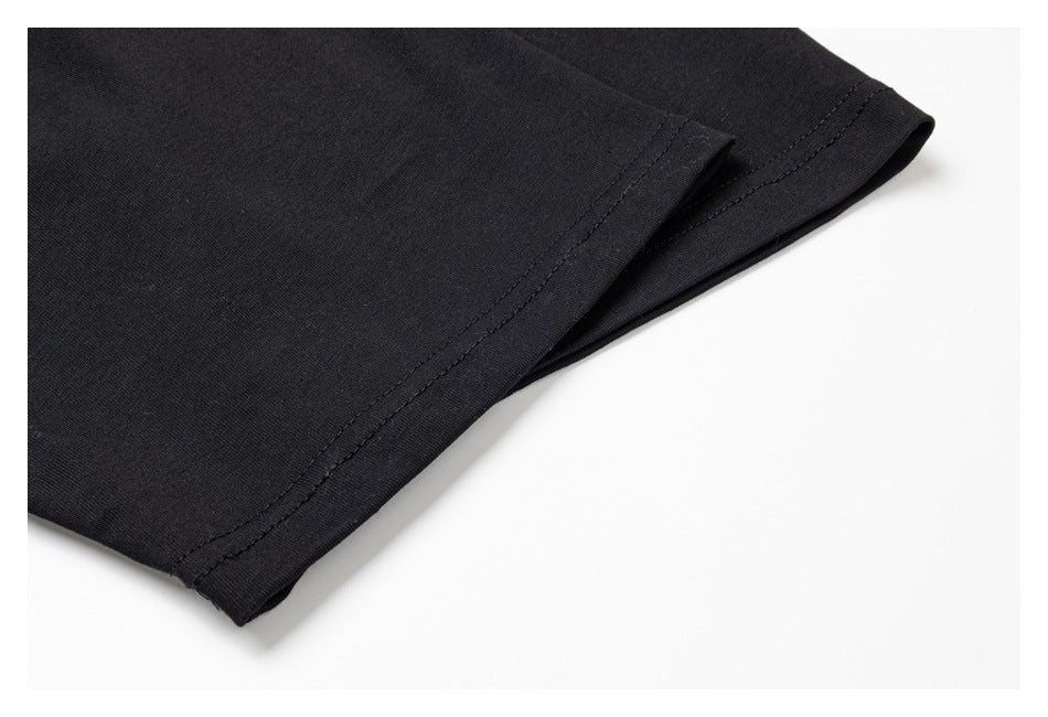 Close-up of a black garment sleeve opening with a double-stitched hem.