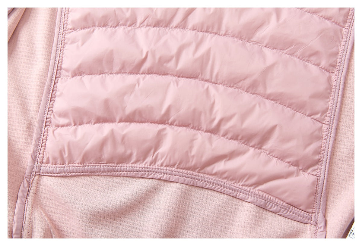 Close-up of the inside of a pink jacket, showing a curved quilted panel and textured lining.